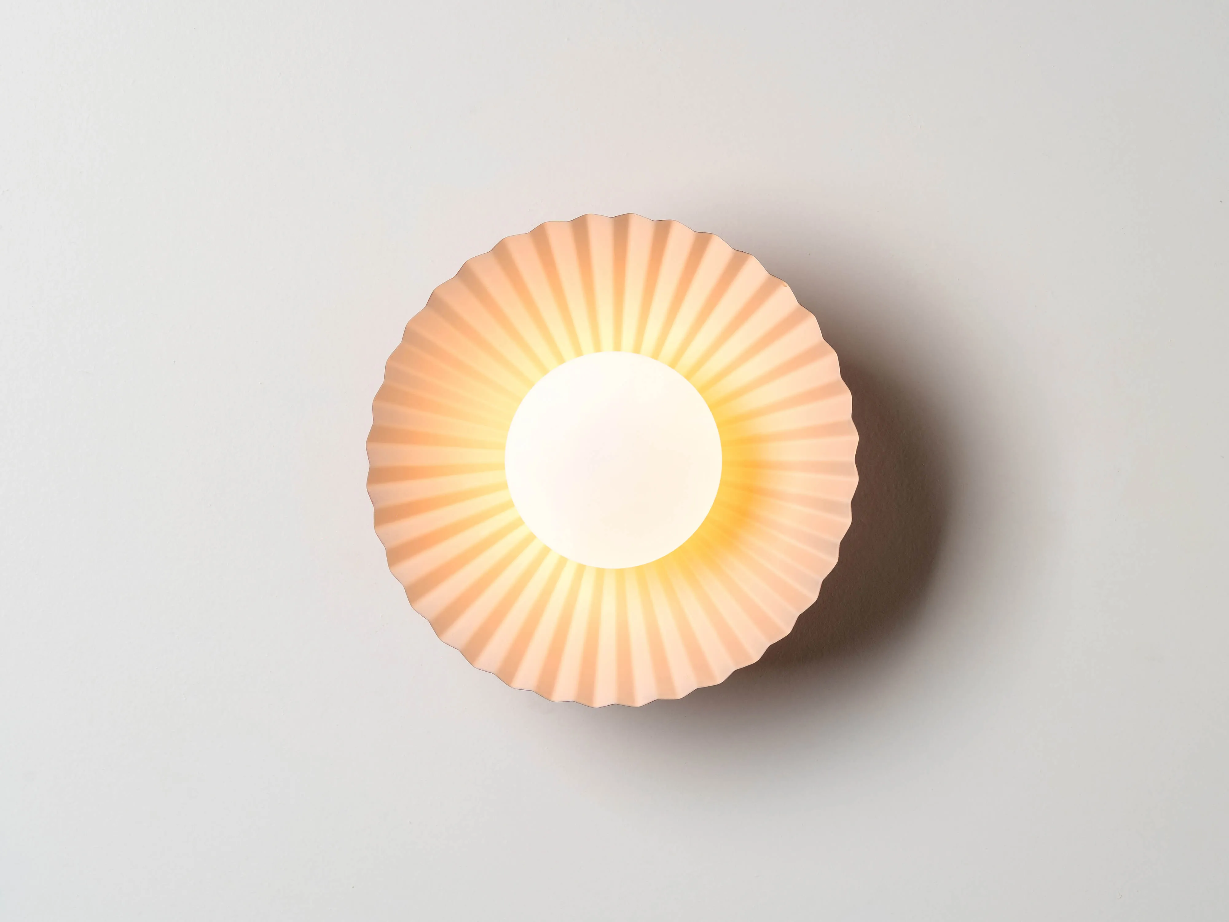 Burnt orange flush pleat wall light