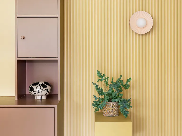 Burnt orange flush pleat wall light